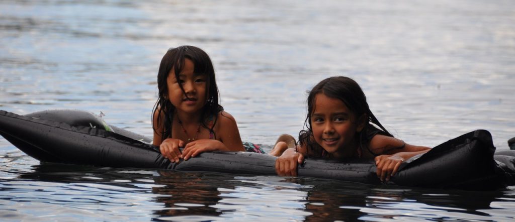 two kids on raft